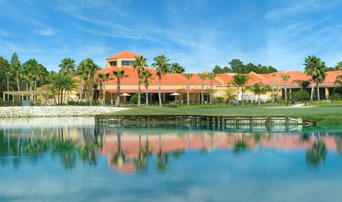 Lake with golf and clubhouse in background.